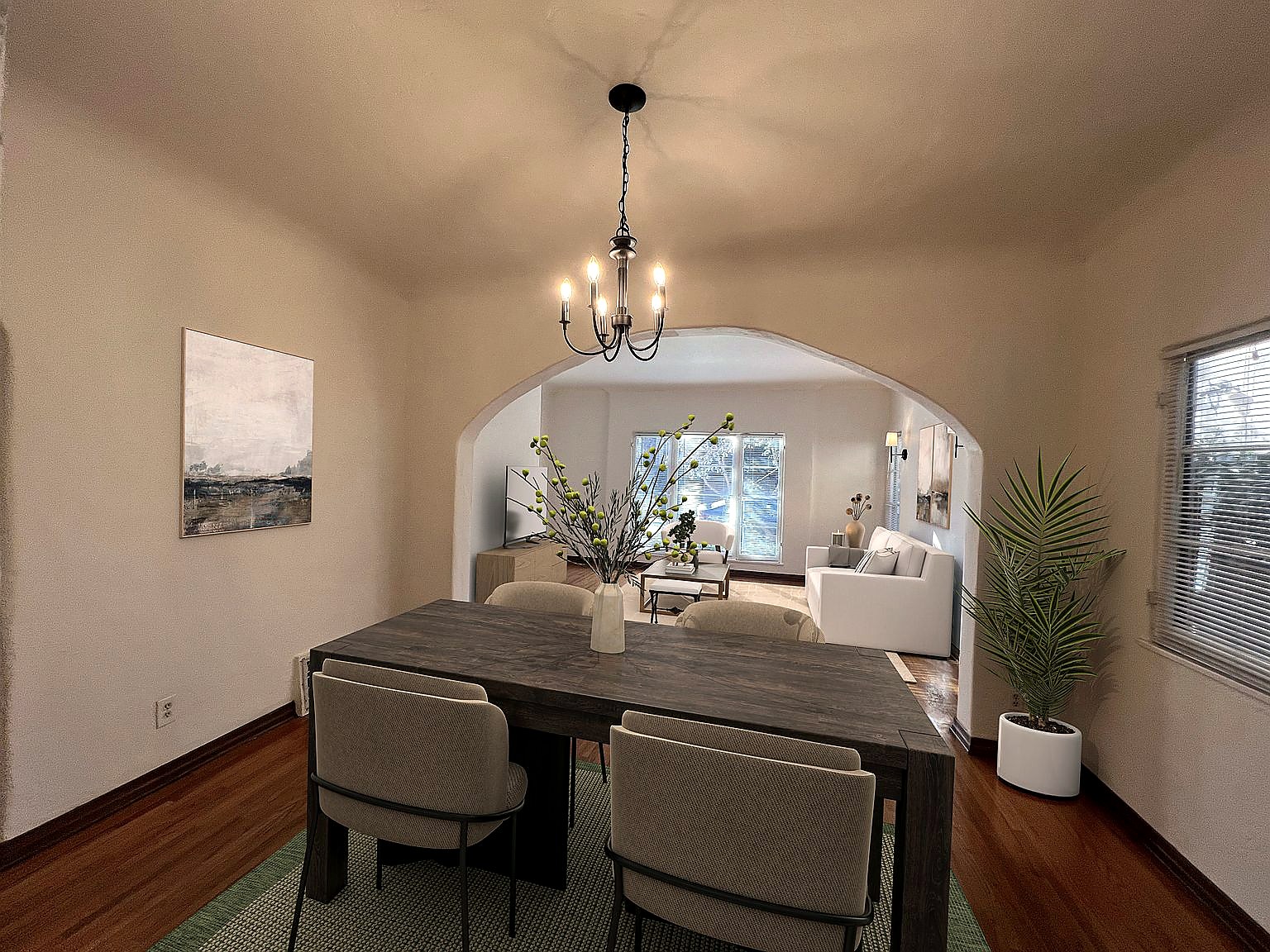 Dining room framed by a graceful Spanish archway